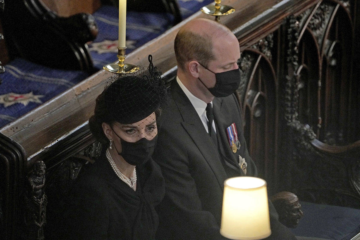 Britain's Prince William and Kate Duchess of Cambridge sit together at St. George’s Chap ...