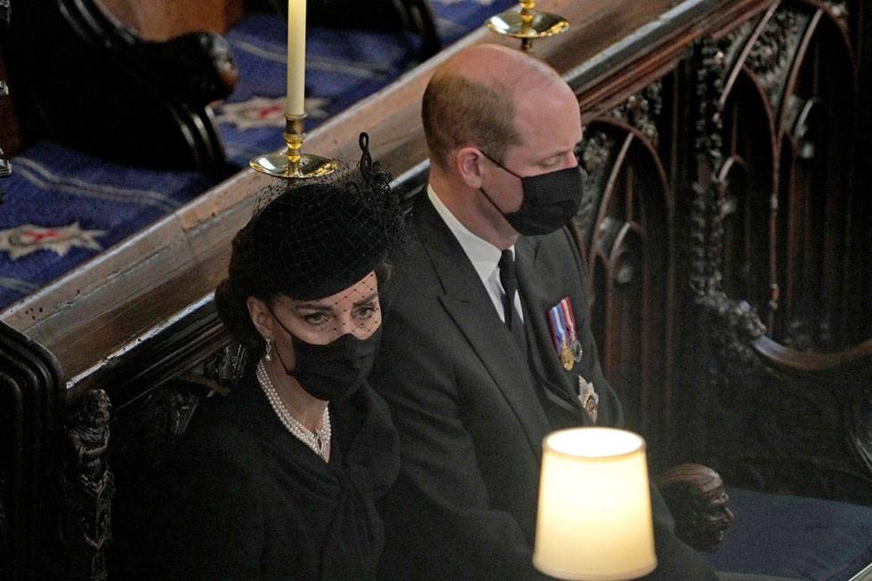 Britain's Prince William and Kate Duchess of Cambridge sit together at St. George’s Chap ...