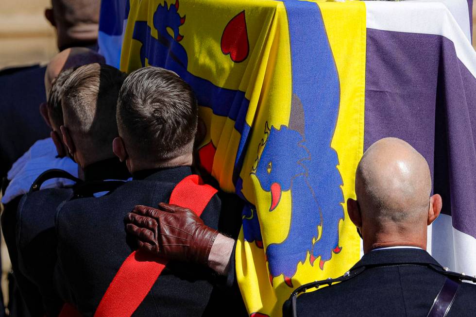 The coffin is carried inside the St George's Chapel for the funeral of Britain's Prince Philip ...