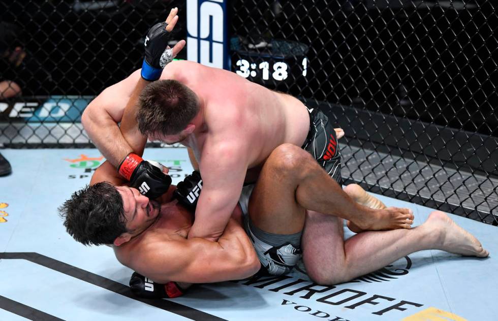 Alexandr Romanov of Moldova punches Juan Espino of Spain in a heavyweight fight during the UFC ...