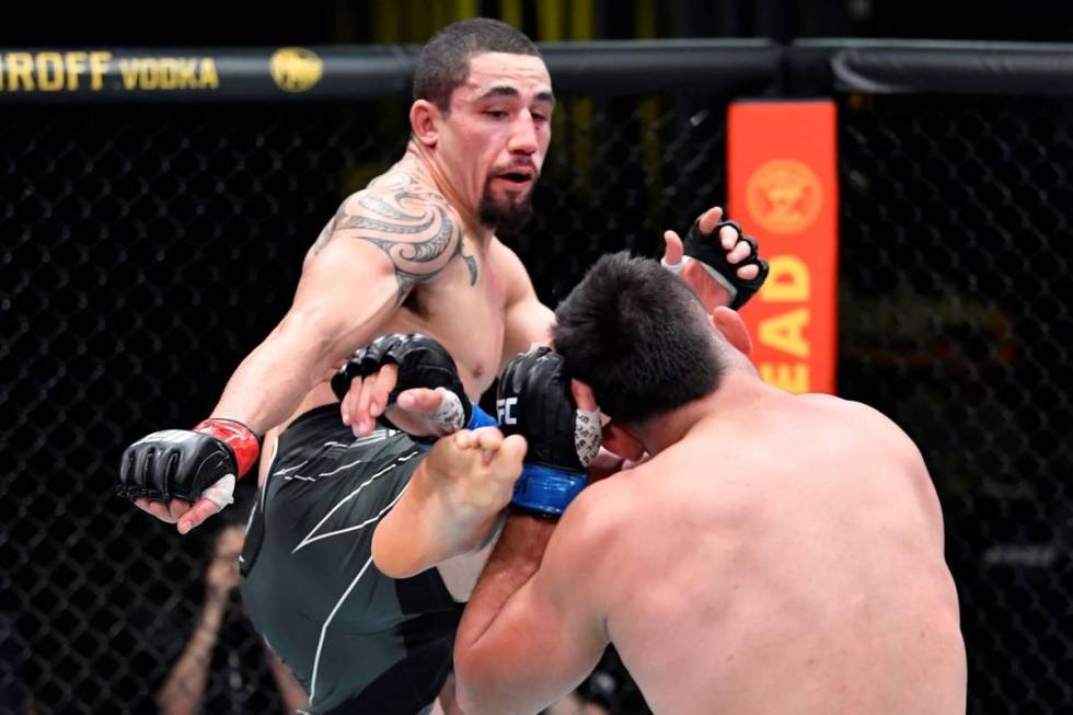 Robert Whittaker of Australia kicks Kelvin Gastelum during the UFC Fight Night event at UFC APE ...