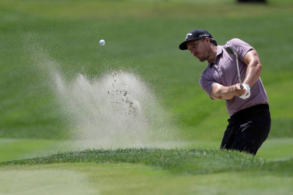 Jamie Lovemark hits from a sand trap on the fifth hole during the second round of the Travelers ...