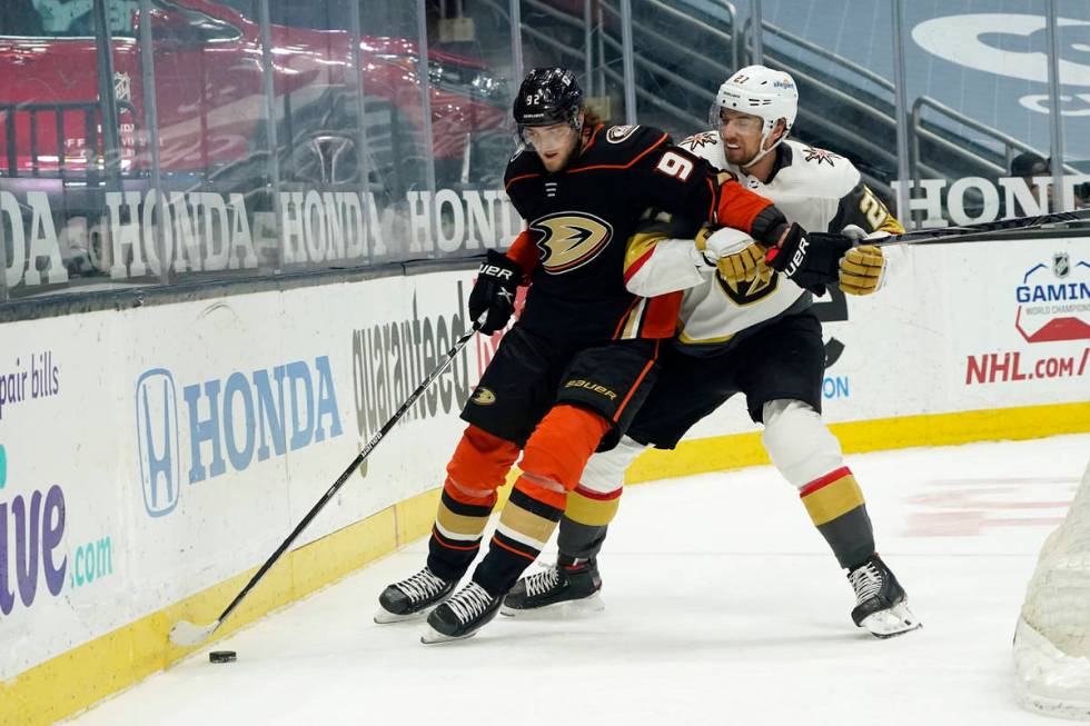 Anaheim Ducks right wing Alexander Volkov, left, is defended by Vegas Golden Knights defenseman ...
