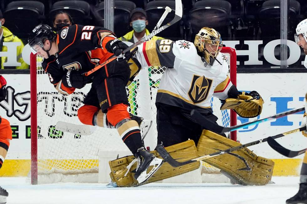 Anaheim Ducks' Sam Steel (23) collides with Vegas Golden Knights goaltender Marc-Andre Fleury ( ...
