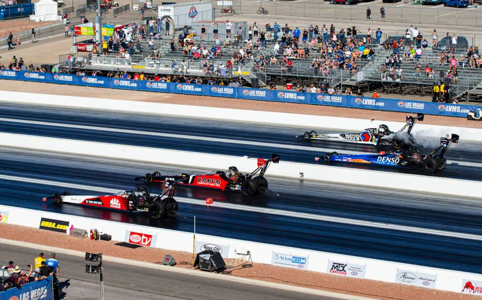 Steve Torrence, second from left, competes to win against drivers, from left, Doug Kalitta, Cla ...