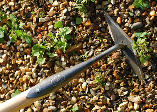 A diamond hoe is used when removing weeds from soils without rocks such as raised beds. (Bob Mo ...