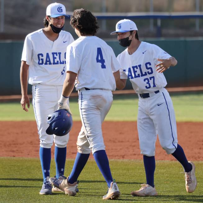 Bishop Gorman's Anthony Marnell (4) celebrates a walk-off hit with teammates Raffael Chiarella ...