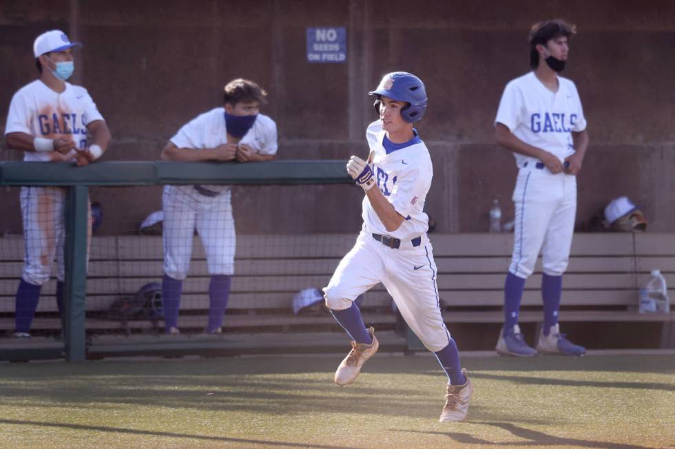 Bishop Gorman's Tommy Rose (23) runs home for a run in the fourth inning of the baseball game a ...