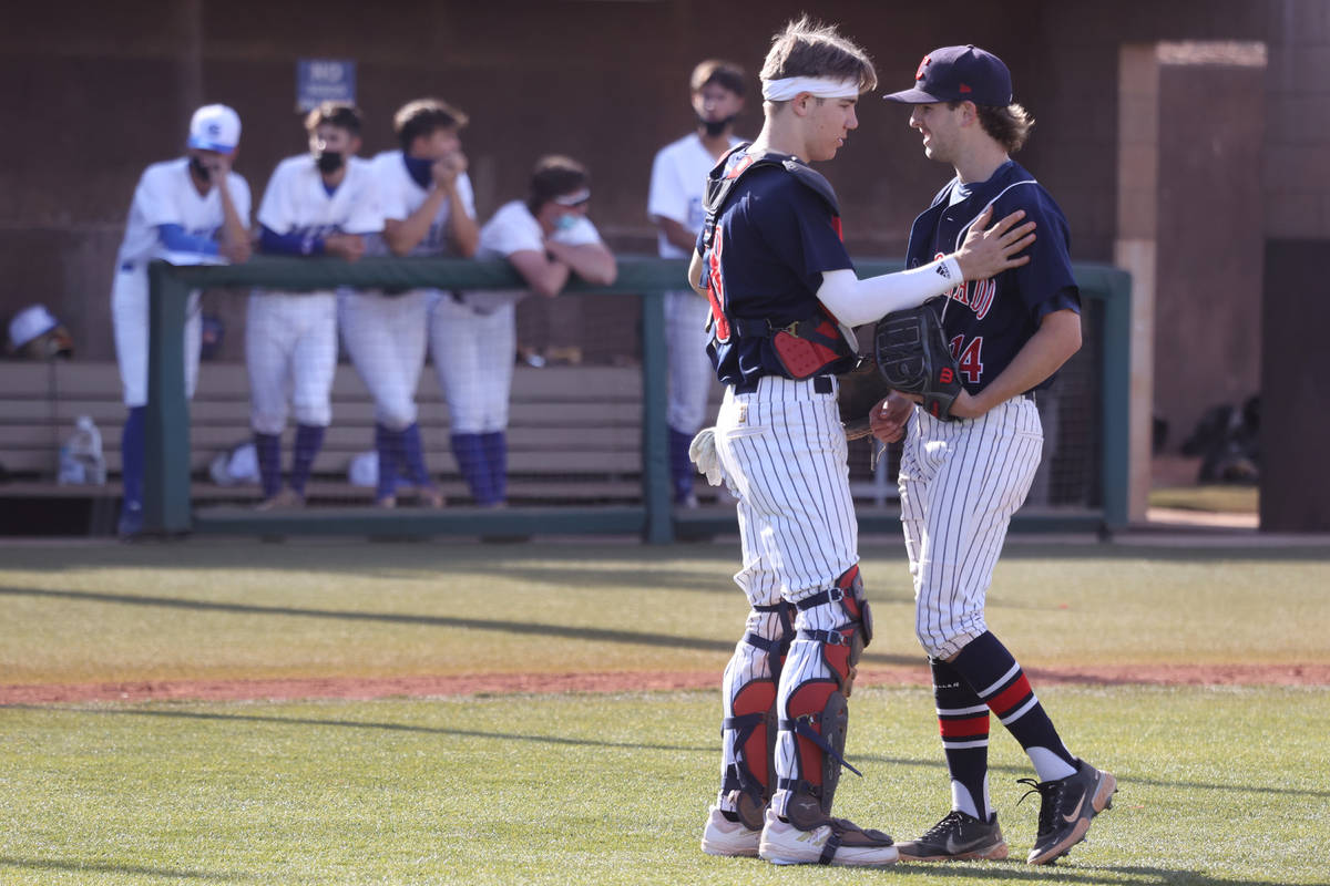 Coronado's catcher Caden Denning (18) takes a moment to talk to pitcher Jordan Writer (14) in t ...