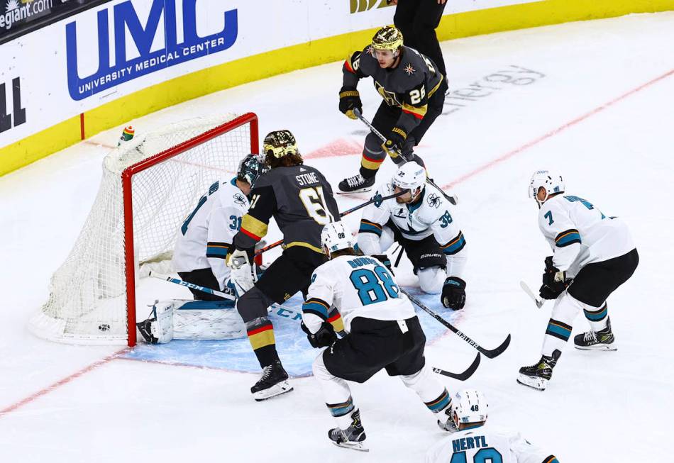 Golden Knights' Mark Stone (61) scores against San Jose Sharks goaltender Martin Jones (31) dur ...