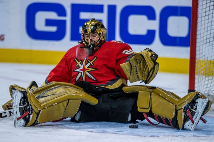 Golden Knights goaltender Marc-Andre Fleury (29) looks to a puck prior to the first period of a ...