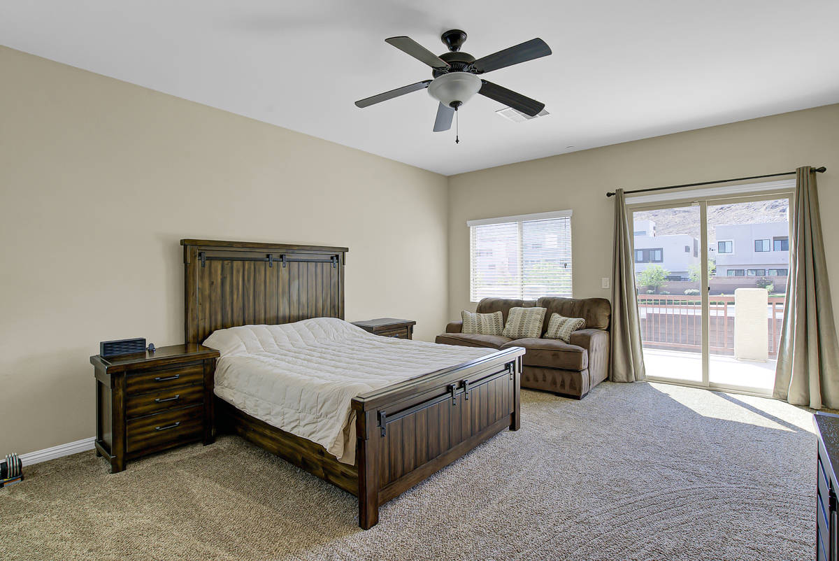 The primary bedroom at 837 Motherwell Ave. in Henderson looks out onto a balcony. (Casie and D ...