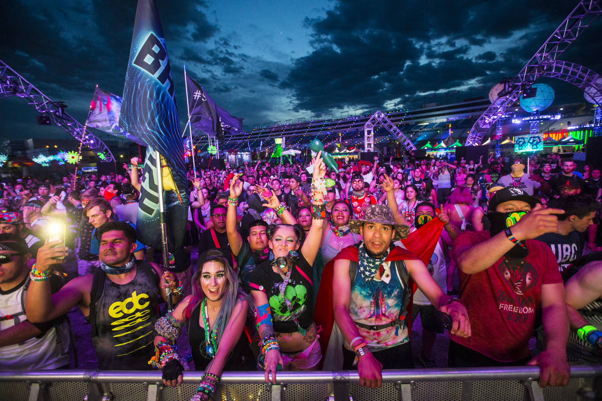 Attendees dance as Dateless performs at the Stereobloom stage during the third day of the Elect ...