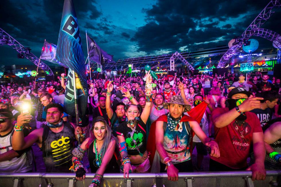 Attendees dance as Dateless performs at the Stereobloom stage during the third day of the Elect ...