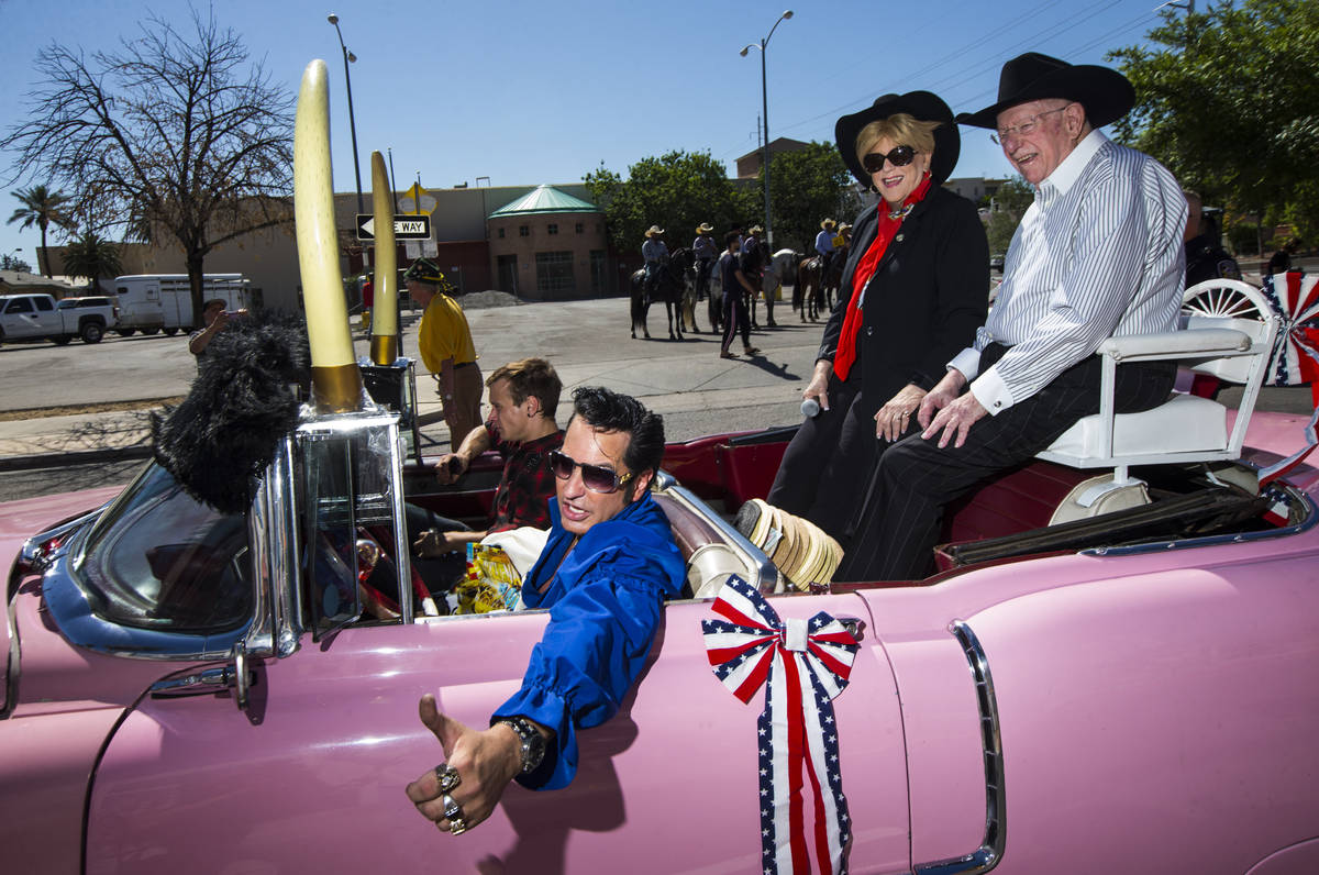 Elvis impersonator Jesse Garon, left, poses with Mayor Carolyn Goodman, center, and her husband ...