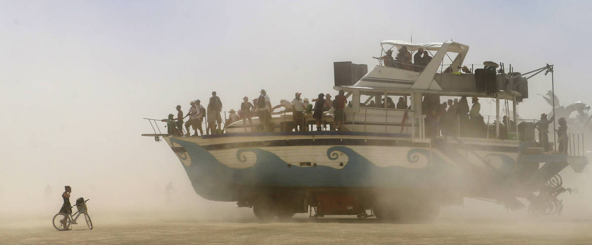 An art car moves along the playa during Burning Man at the Black Rock Desert north of Reno on T ...