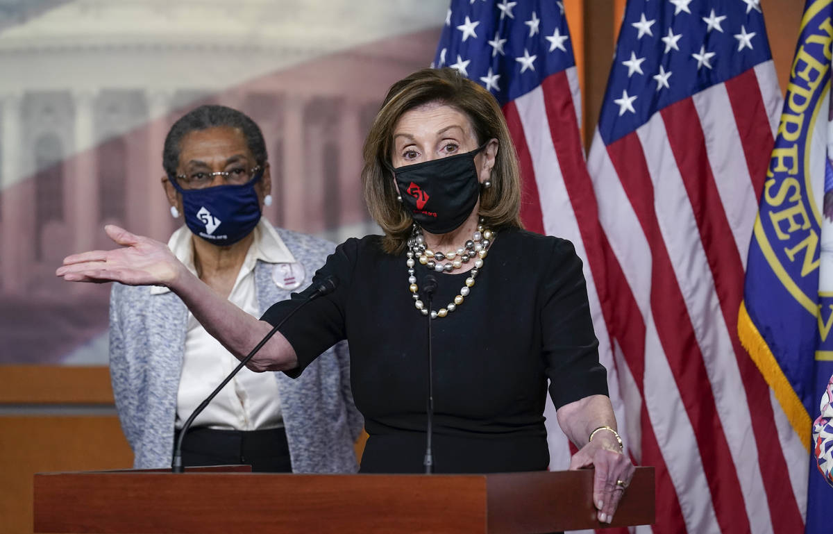 In this April 21, 2021, photo, House Speaker Nancy Pelosi, D-Calif., joins Del. Eleanor Holmes- ...