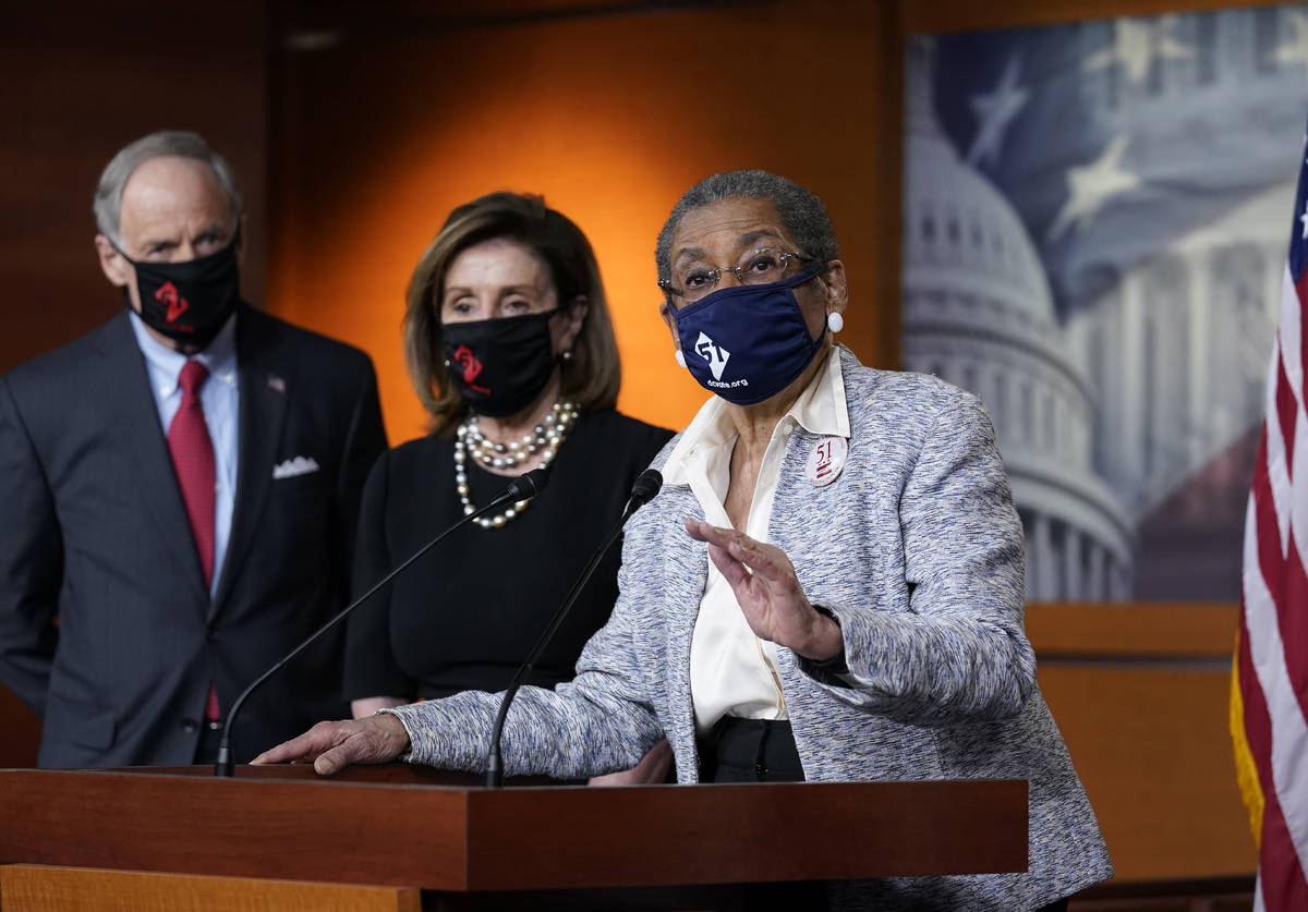 In this April 21, 2021, photo, Del. Eleanor Holmes-Norton, D-D.C., center, joined from left by ...