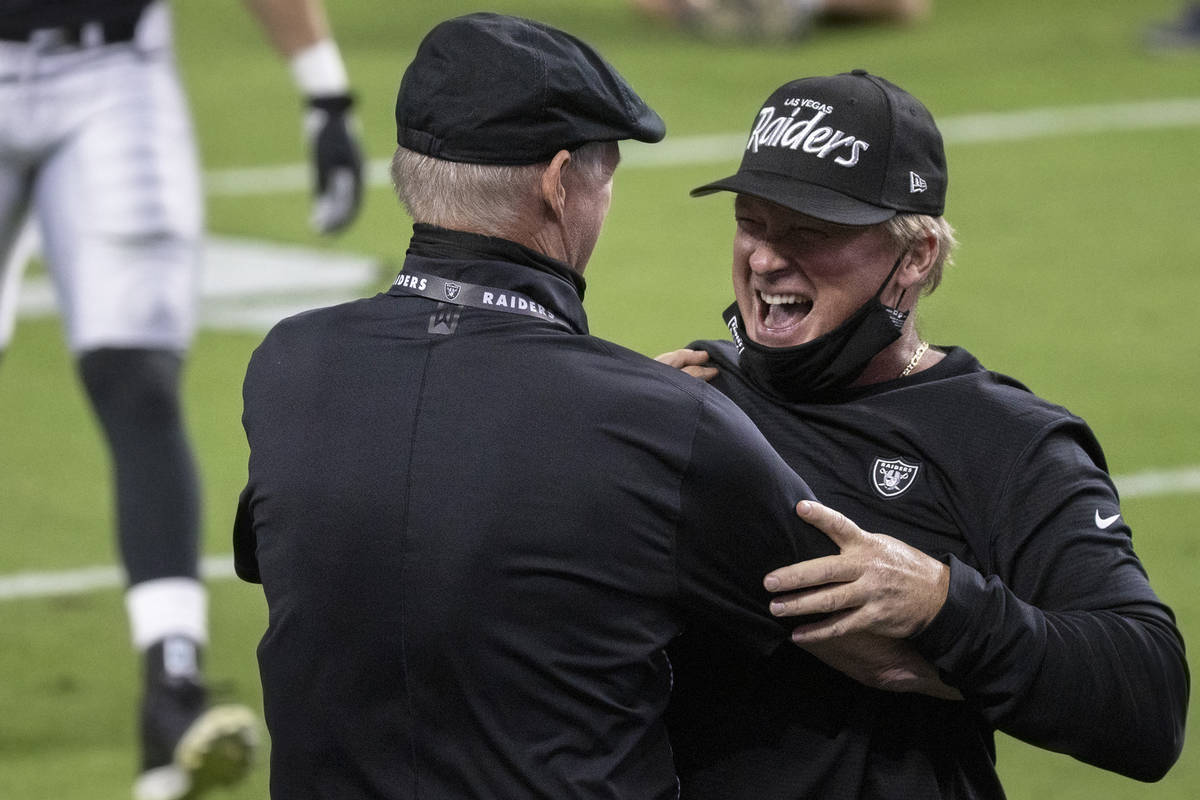 Las Vegas Raiders head coach Jon Gruden, right, celebrates with general manager Mike Mayock aft ...