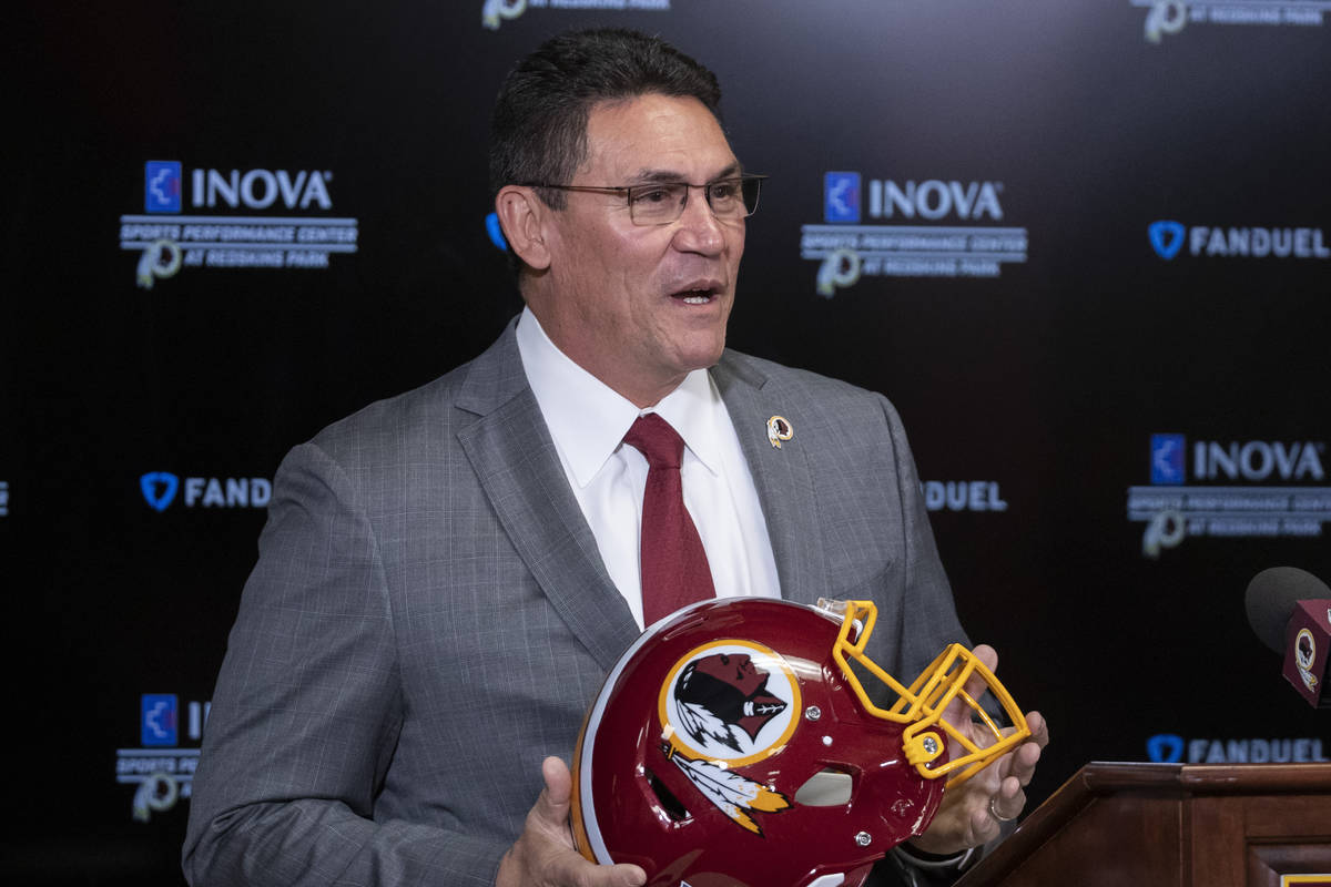 FILE - In this Jan. 2, 2020, file photo, Washington Redskins head coach Ron Rivera holds up a h ...
