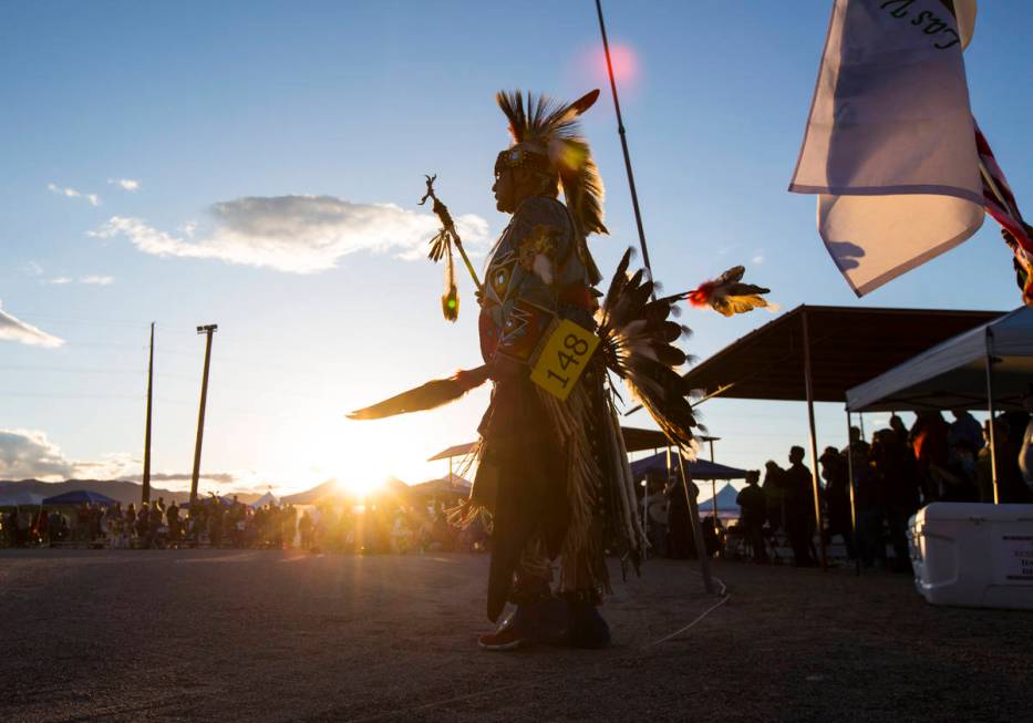 Thomas Edison Yazzie, left, prepares to lead off the dance as part of the grand entry ceremonie ...