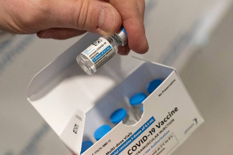 In this Wednesday, March 3, 2021 file photo, a pharmacist holds a vial of the Johnson & Johnson ...