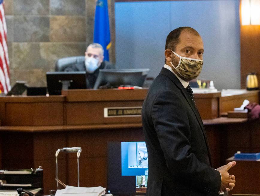 Prosecutor Christopher Hamner looks back as he addresses the court during a hearing for Aaron G ...