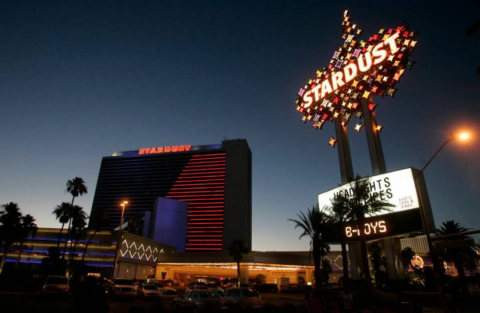 The Stardust hotel-casino glows in its signature blue and red neon as the sun sets Tuesday, Jun ...