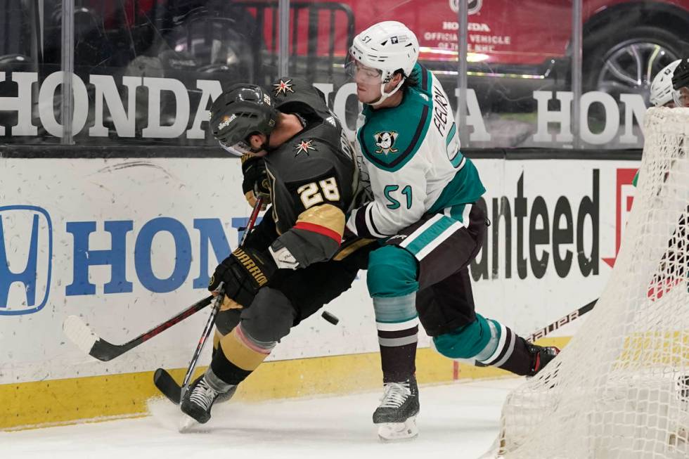 Anaheim Ducks' Haydn Fleury, right, defends against Vegas Golden Knights' William Carrier durin ...