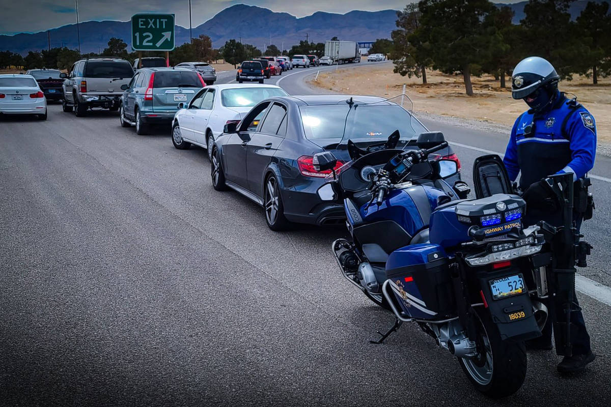A Nevada Highway Patrol trooper pulls over drivers for driving on the shoulder of the highway. ...