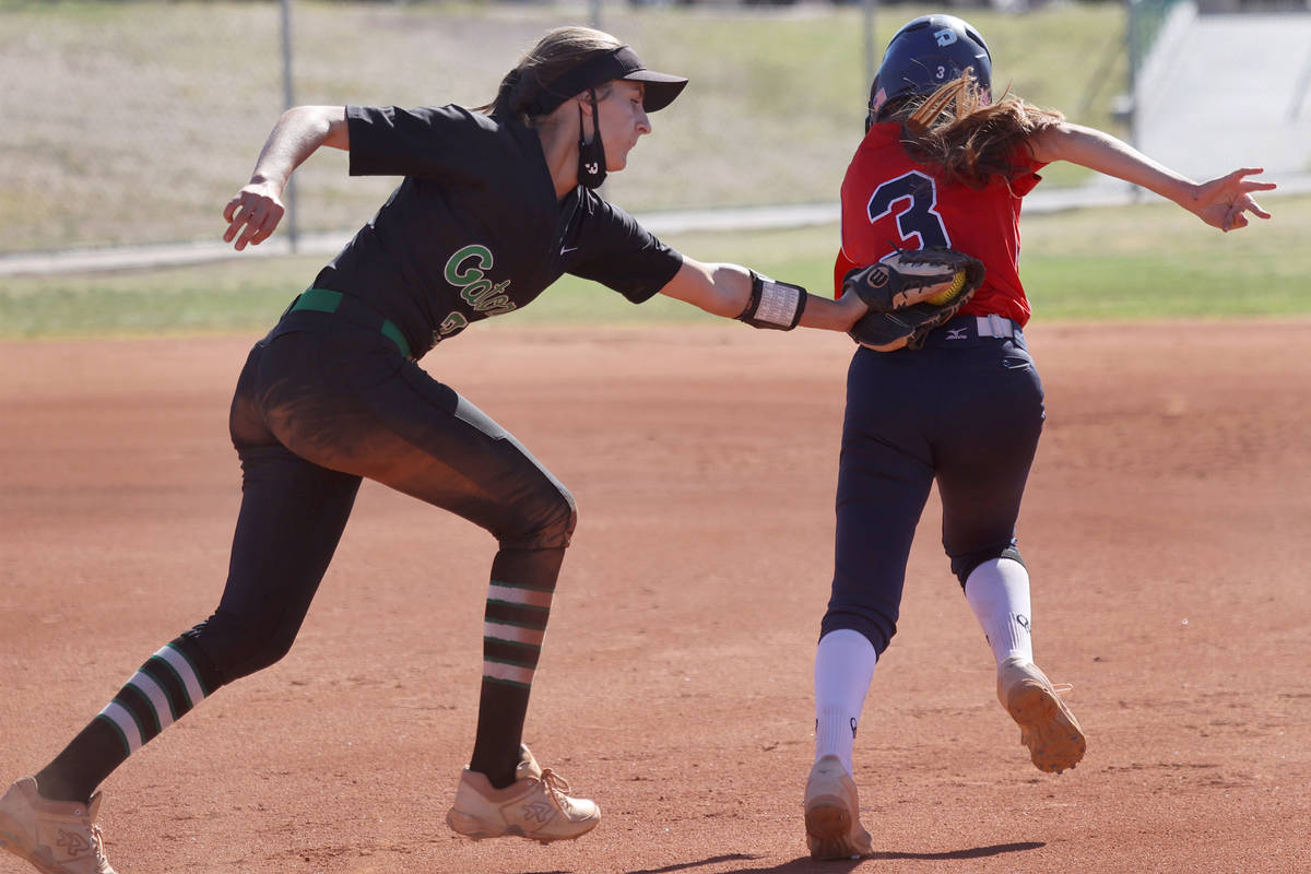 Green Valley's Mickey Morris (3) tags Coronado's MaKala Reynolds (3) for an out in the third in ...