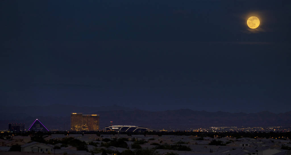 The Super Pink Moon south of the Strip above the clouds on Monday, April 26, 2021 in Las Vegas. ...