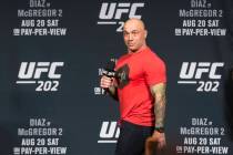 UFC color commentator Joe Rogan reacts after Conor McGregor stormed out of the stage following ...
