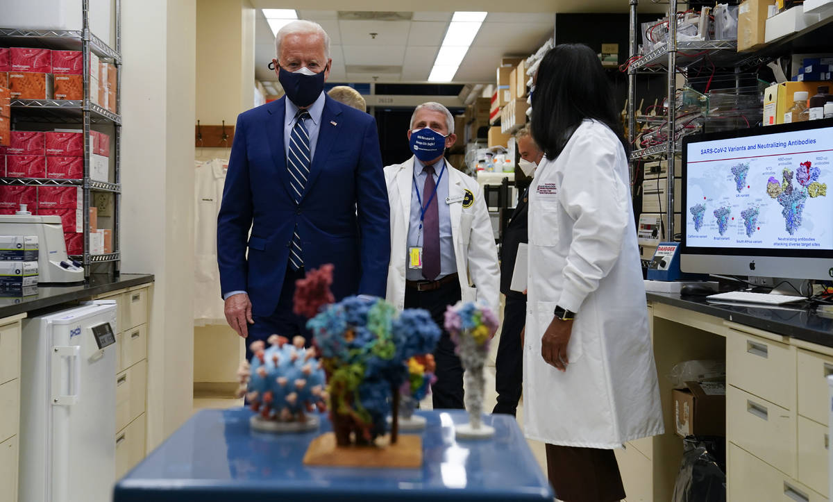 FILE - In this Feb. 11, 2021, file photo President Joe Biden visits the Viral Pathogenesis Labo ...