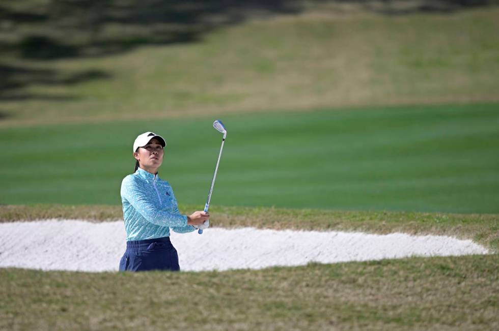 Danielle Kang watches after hitting out of a bunker onto the fourth green during the final roun ...