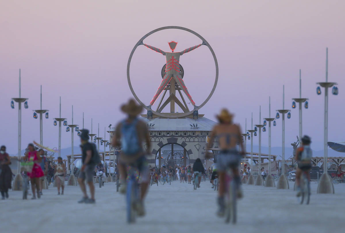 The Burning Man effigy, modeled after the Leonardo da Vinci's Vitruvian Man, stands above the p ...
