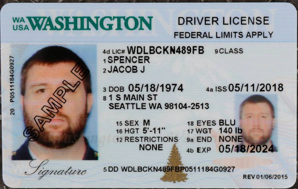 In this June 22, 2018, file photo a sample copy of a Washington drivers license is shown at the ...