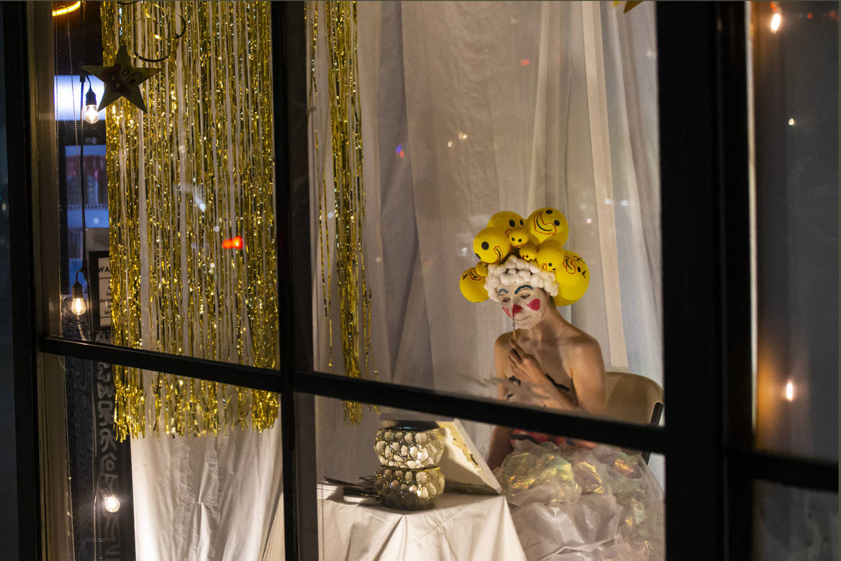 Heidi Rider performs from the windows of the Majestic Repertory Theatre in the Arts District of ...