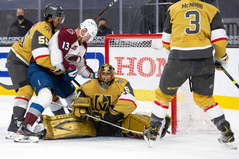 Golden Knights goaltender Marc-Andre Fleury (29) saves a shot on goal as Golden Knights right w ...