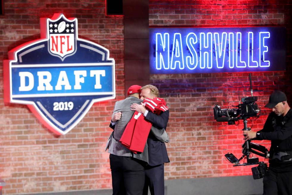 Commissioner Roger Goodell hugs Nick Bosa after Bosa was selected by the San Francisco 49ers wi ...