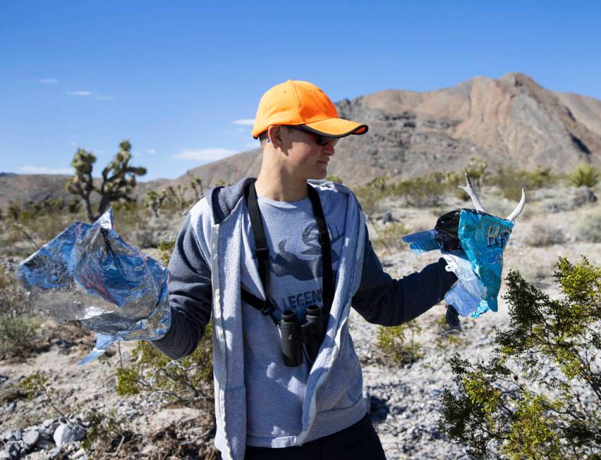 Christian Daniels, 15, displays stray balloons he retrieved from desert areas on Saturday, Apri ...