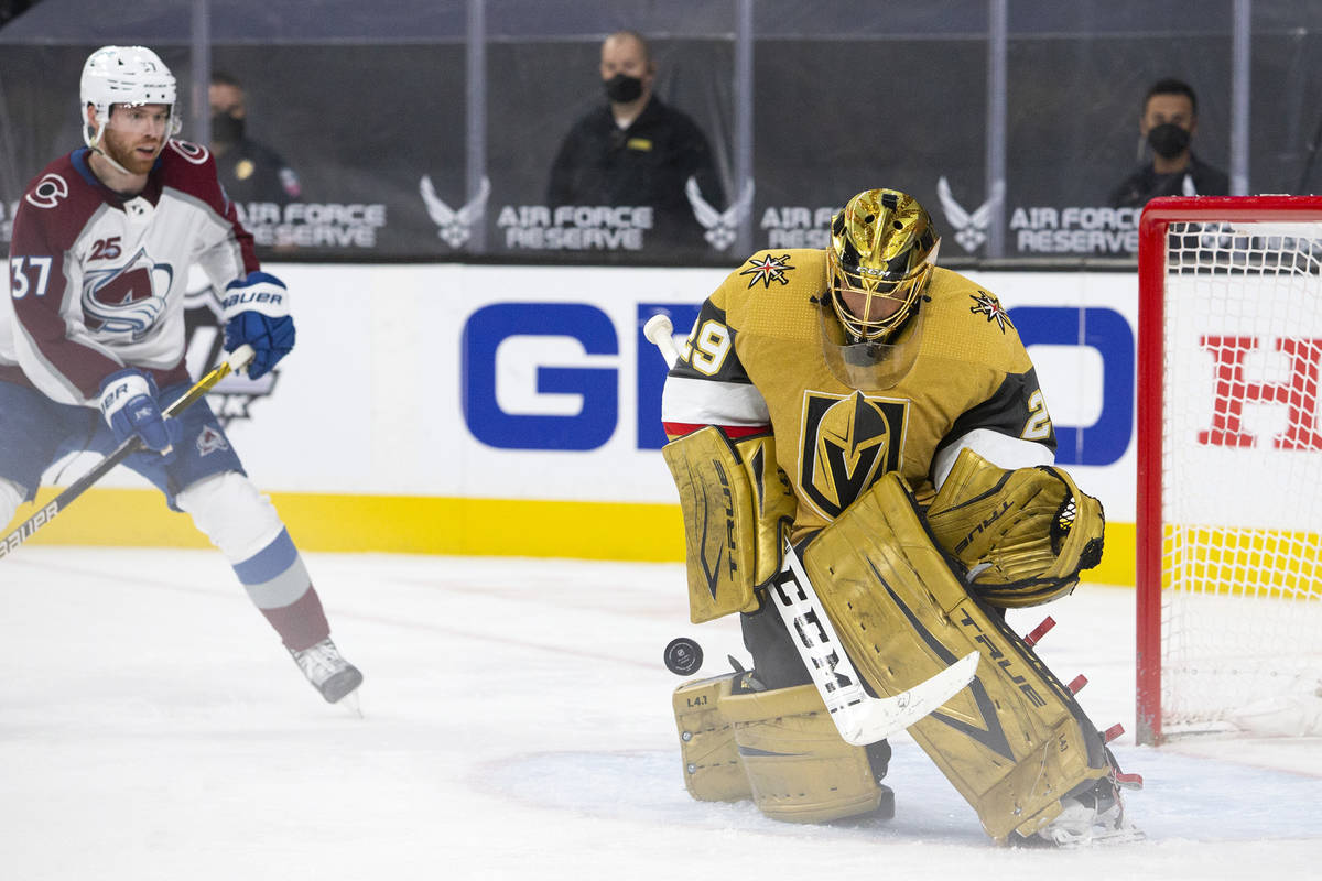 Golden Knights goaltender Marc-Andre Fleury (29) makes a save while Avalanche left wing J.T. Co ...