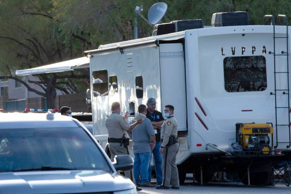 In this Aug. 16, 2020, file photo, Las Vegas police investigate a police shooting in the 2800 b ...