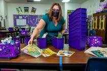 Long STEAM Academy teacher Shana Prue just received several boxes of school supplies and unpack ...