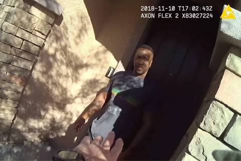 Metro police bodycam video screenshot shows Henderson corrections officer Darius Brown in the d ...