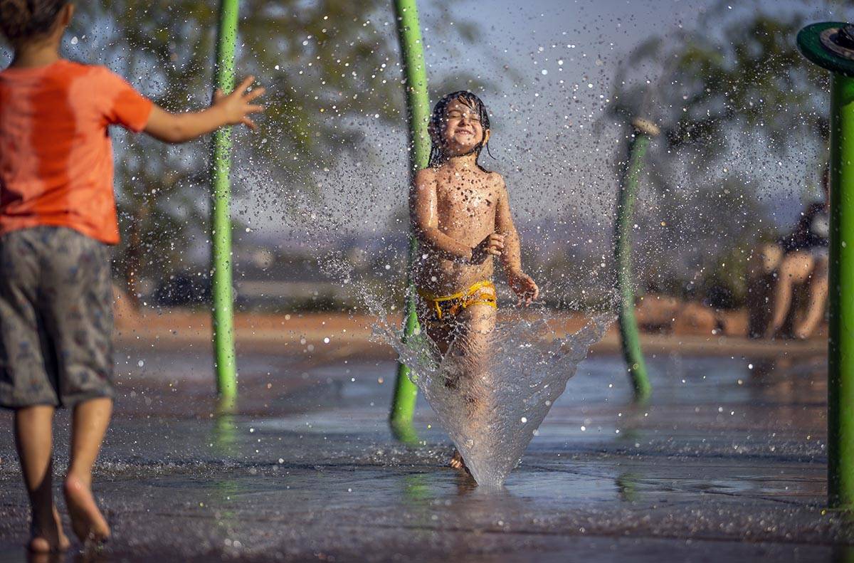 Bodhi Brown, 5, is in his happy place while playing in the water park at Bill Briare Family Par ...