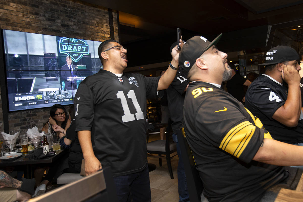 Frank Zacarias, left, and Edward Hernandez react as the Raiders announce Alabama offensive tack ...