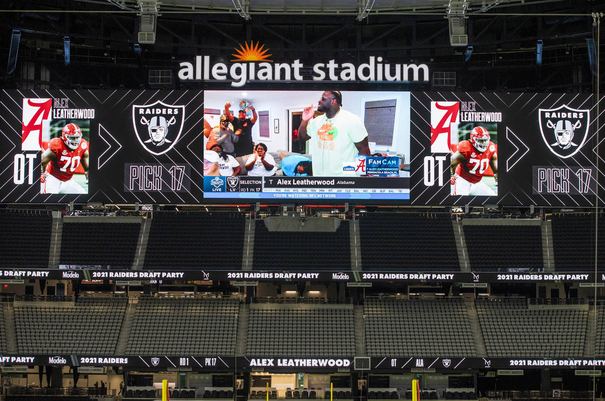 Alex Leatherwood of Alabama is shown on the screen while announced as the teamÕs first rou ...