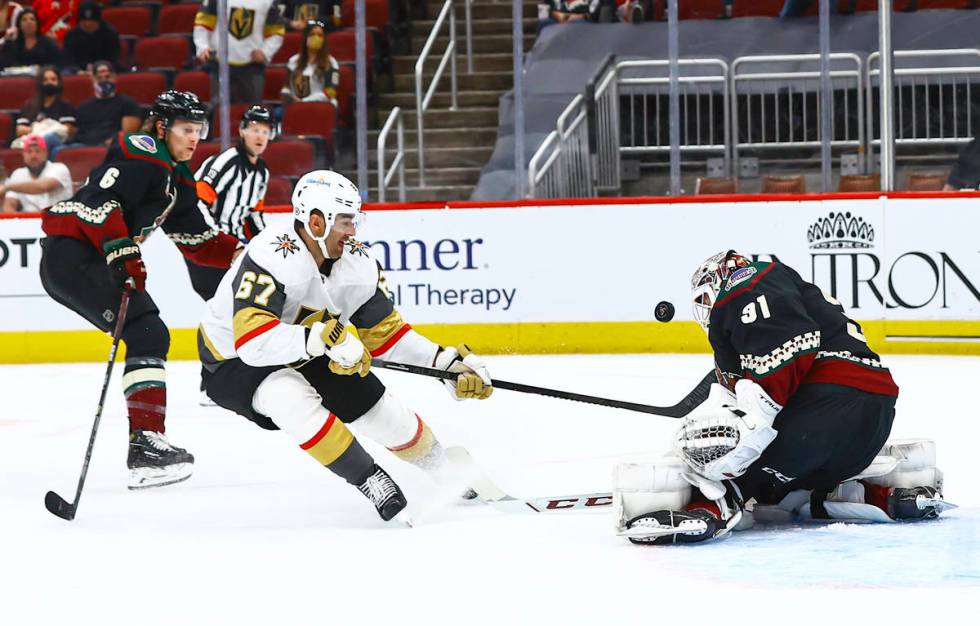 Arizona Coyotes goaltender Adin Hill (31) blocks a shot from Golden Knights' Max Pacioretty (67 ...