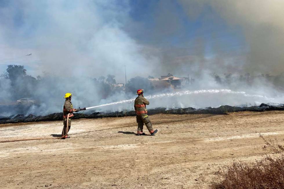 Clark County firefighters were responding to a large brush fire at Sunset Park along Sunset Roa ...